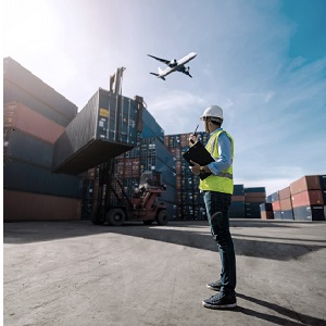 Man in container storage looks at plane